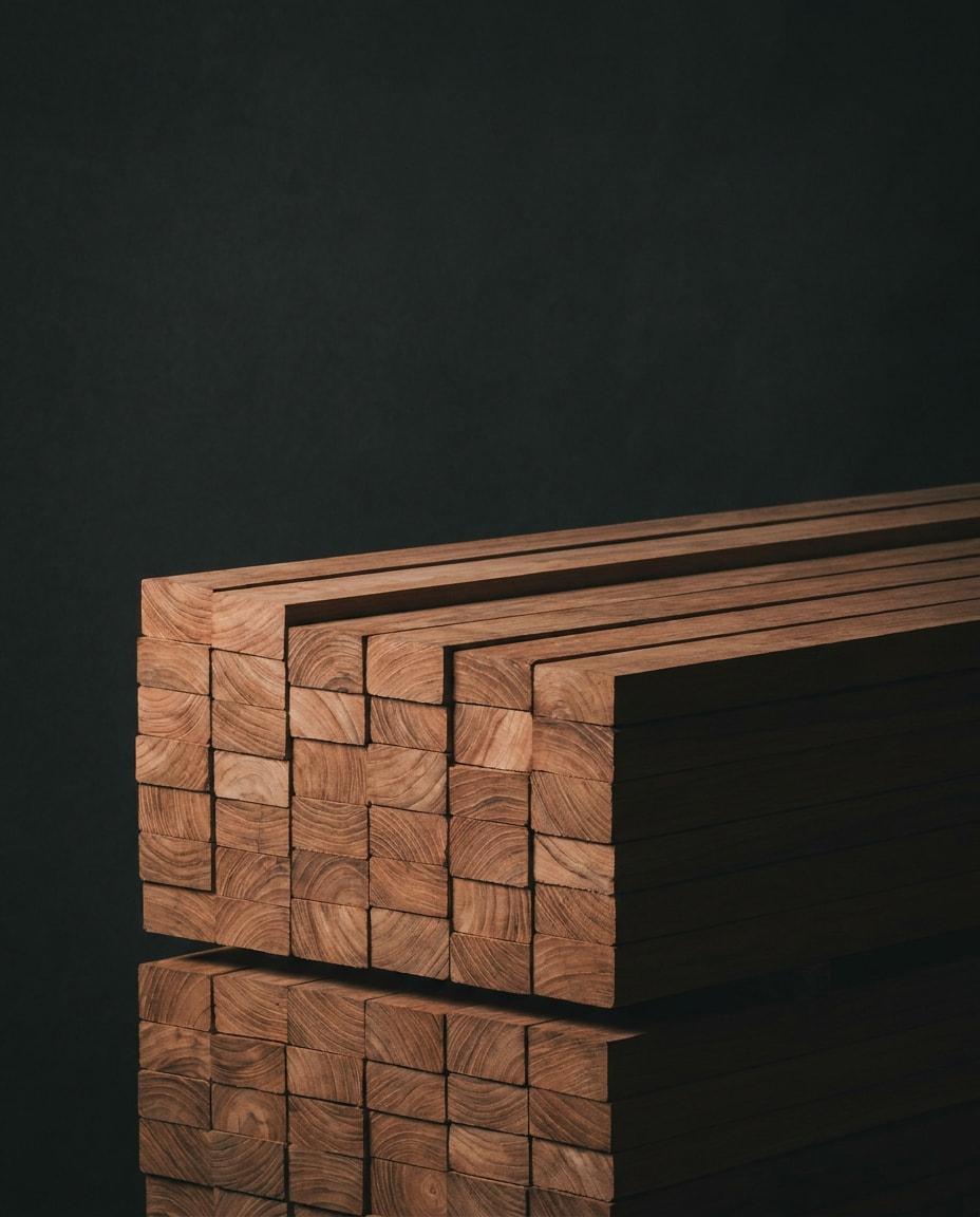 Sawn teak billets stacked into a block with the end grain facing out